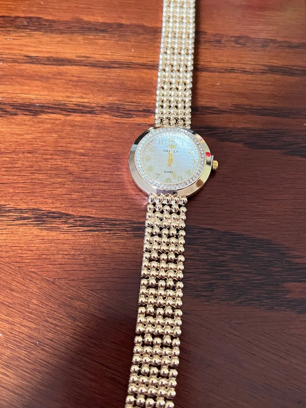 New Grealy ladies gold toned watch